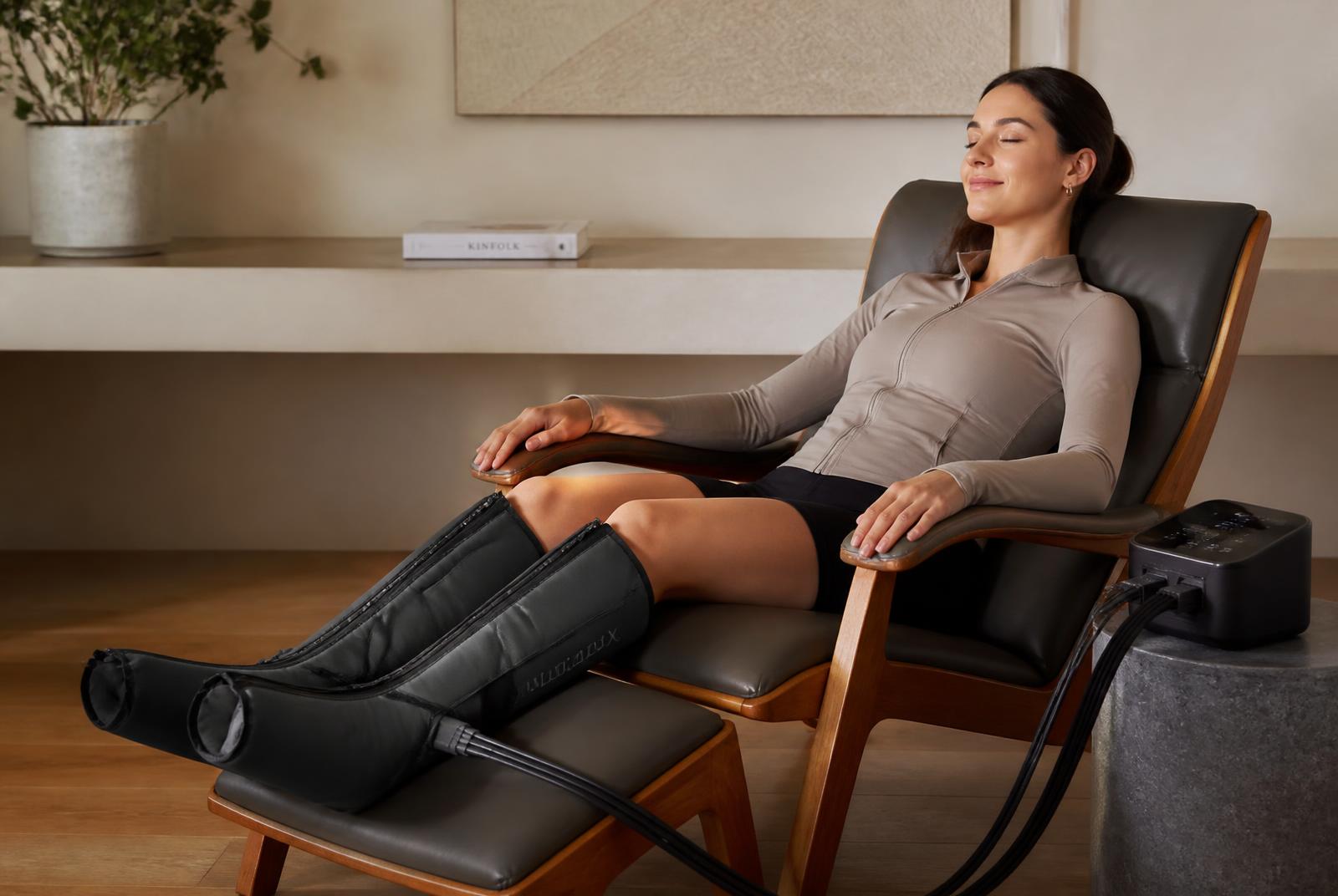 Air-compression leg massager wrapped around the calves of a reclining user